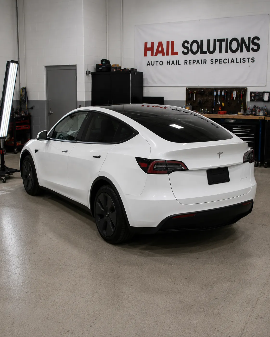 2022 Tesla Model Y hail damage repair in Leawood, KS — detail photo 2