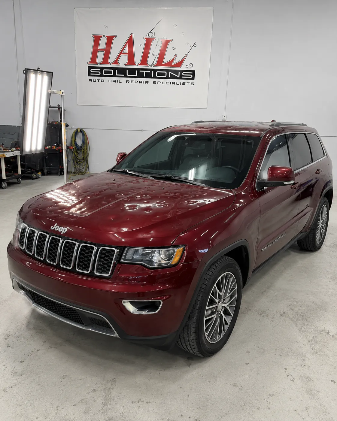 2017 Jeep Grand Cherokee — Velvet Red Pearl after hail damage repair by Hail Solutions in Prairie Village, KS