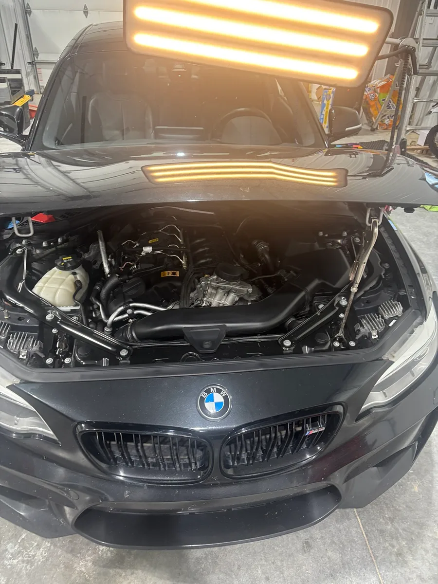 A restored vehicle in the Hail Solutions shop — factory paint intact, no trace of hail damage