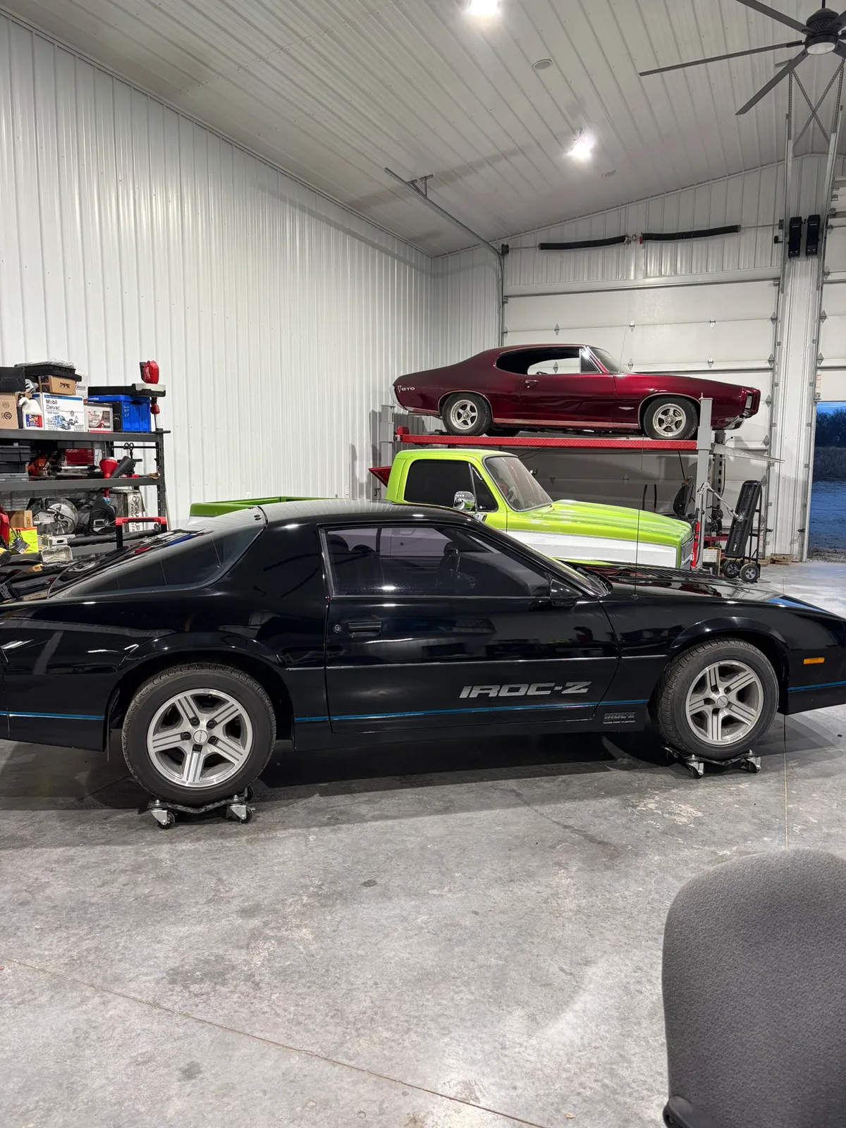 Multi-bay interior of the Hail Solutions paintless dent repair shop in Olathe, Kansas