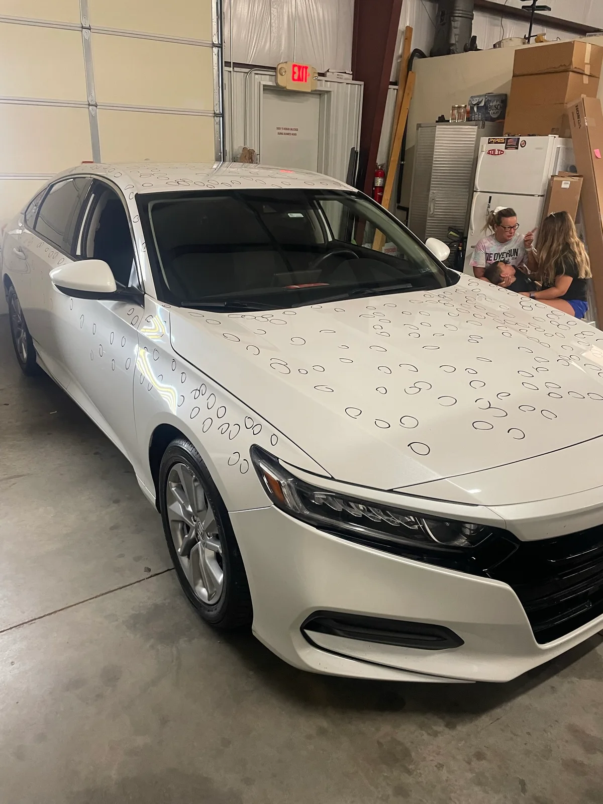 Brian Wilson performing paintless dent repair on a customer vehicle at the Olathe shop