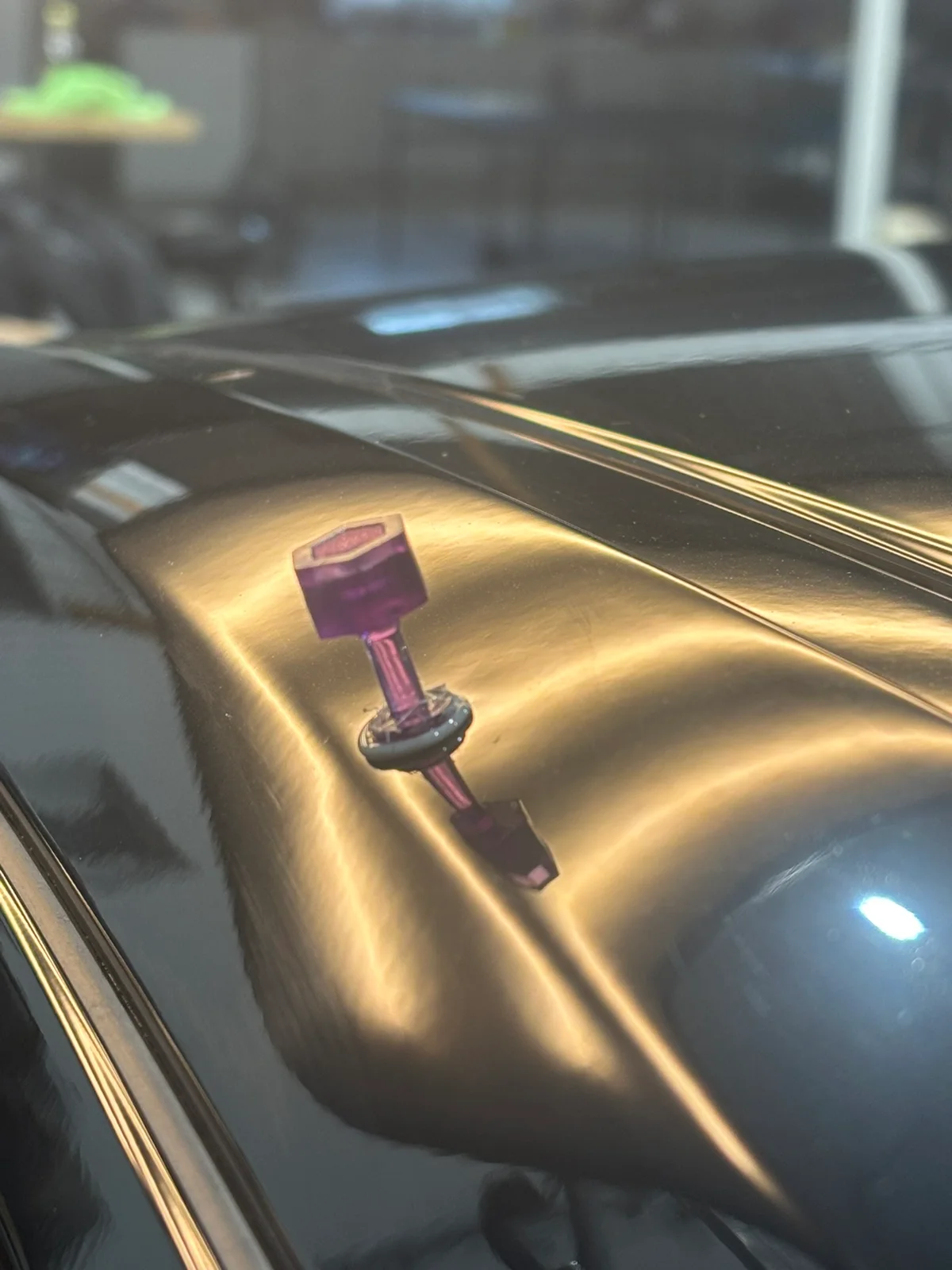 Close-up of hail damage on a customer vehicle — the kind of photo you'd take with your phone